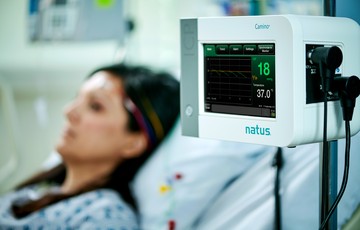 woman in the hospital using natus technology