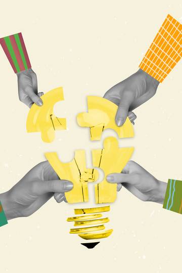 hands placing puzzle pieces