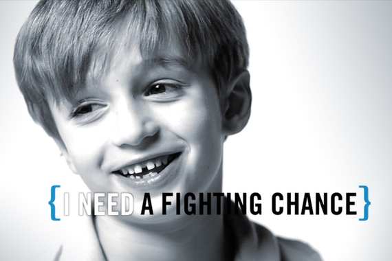 still from a a video of a boy in black and white saying I need a fighting chance