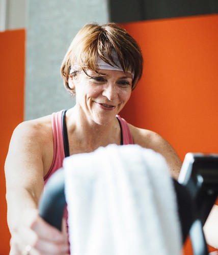 woman exercising on cardio equipment