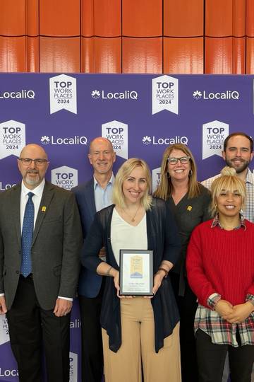 Core team members at top places to work award show