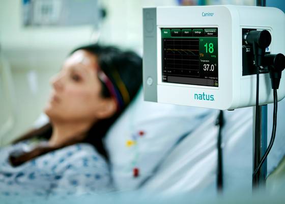 woman in the hospital using natus technology