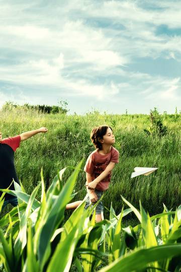 kids throwing paper airplanes