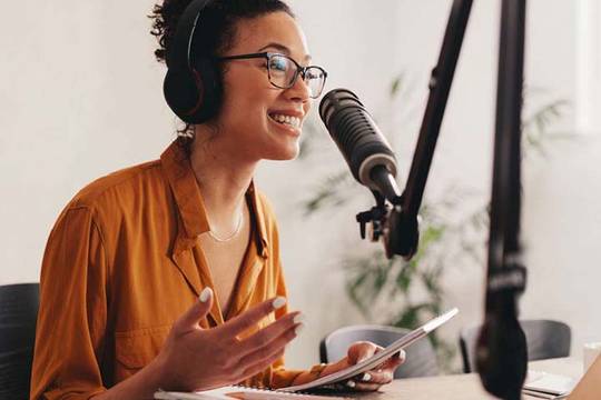 woman talking into a microphone
