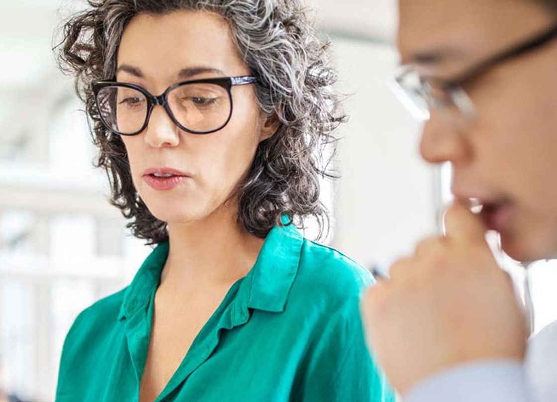 woman with glasses in business meeting