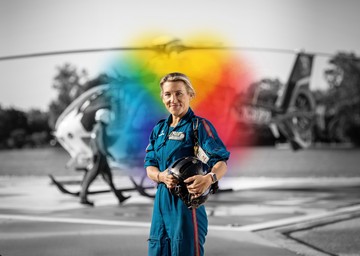 helicopter pilot for ThedaStar behind an explosion of color