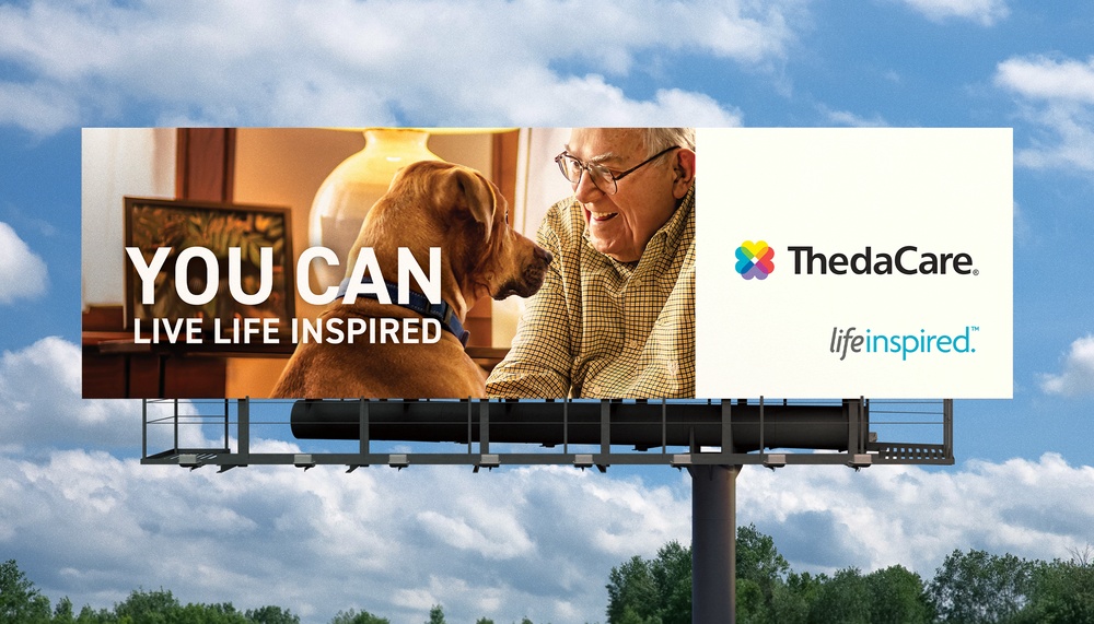ThedaCare Billboard featuring dog and old man with text "YOU CAN LIVE LIFE INSPIRED"