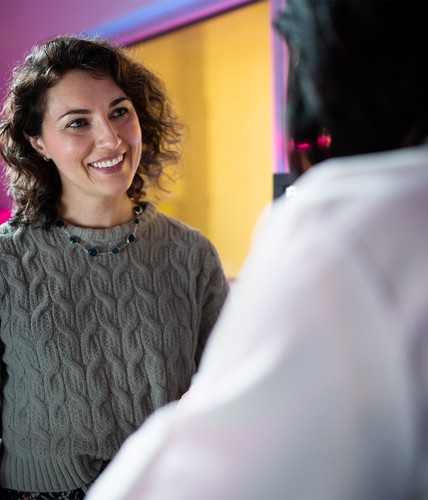 woman smiling at her doctor