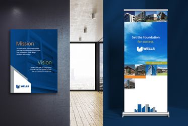 Wells branded poster featuring' "Mission" and "Vision" statements and Wells branded Banner-up "Set the foundation for success" with building imagery