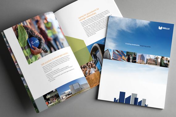Cover and interior spread of wells brand brochure "Creating landmarks. Inspiring pride." featuring building imagery and blue sky