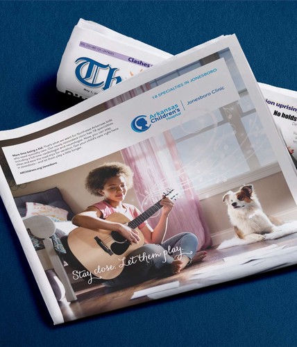 newspaper print ad of an image of a girl playing the guitar with her dog