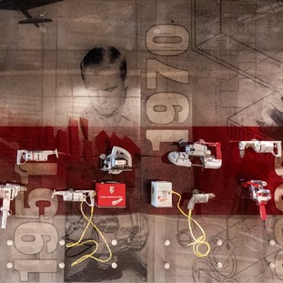 An exhibit showing the timeline of Milwaukee Tool drill development