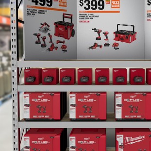 A shelf display of Milwaukee Tool packaging