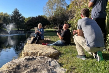 A strategy team of five pictured from above, formulating ideas.